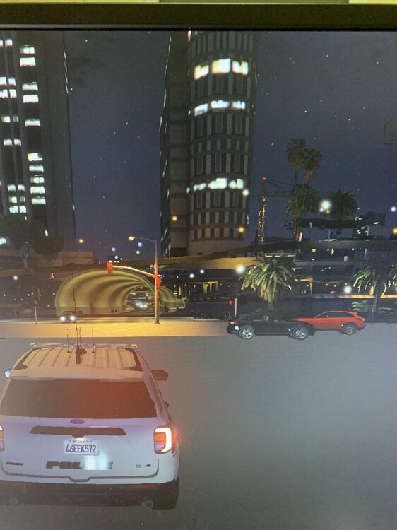 Could contain: text, vehicle, land vehicle, building, billboard, outdoor, city, light, night, street, car