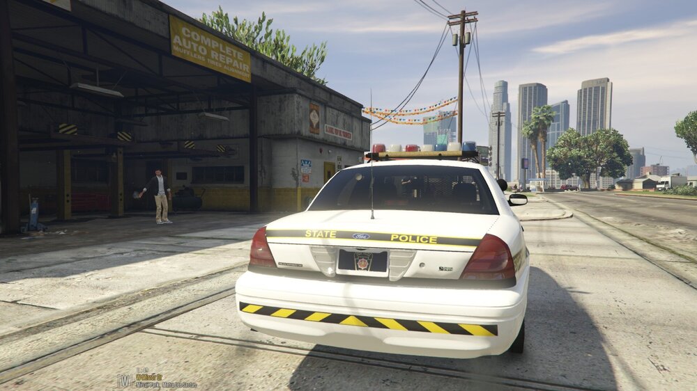 Could contain: vehicle, land vehicle, outdoor, text, sky, vehicle registration plate, wheel, road, building, car, full-size car, mid-size car, sedan, family car, automotive tail & brake light, transport, street, ground, stopped