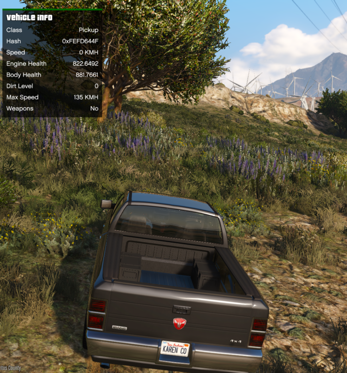 Could contain: outdoor, text, vehicle, land vehicle, plant, wheel, vehicle registration plate, sky, automotive tail & brake light, automotive exterior, grass, mountain, car