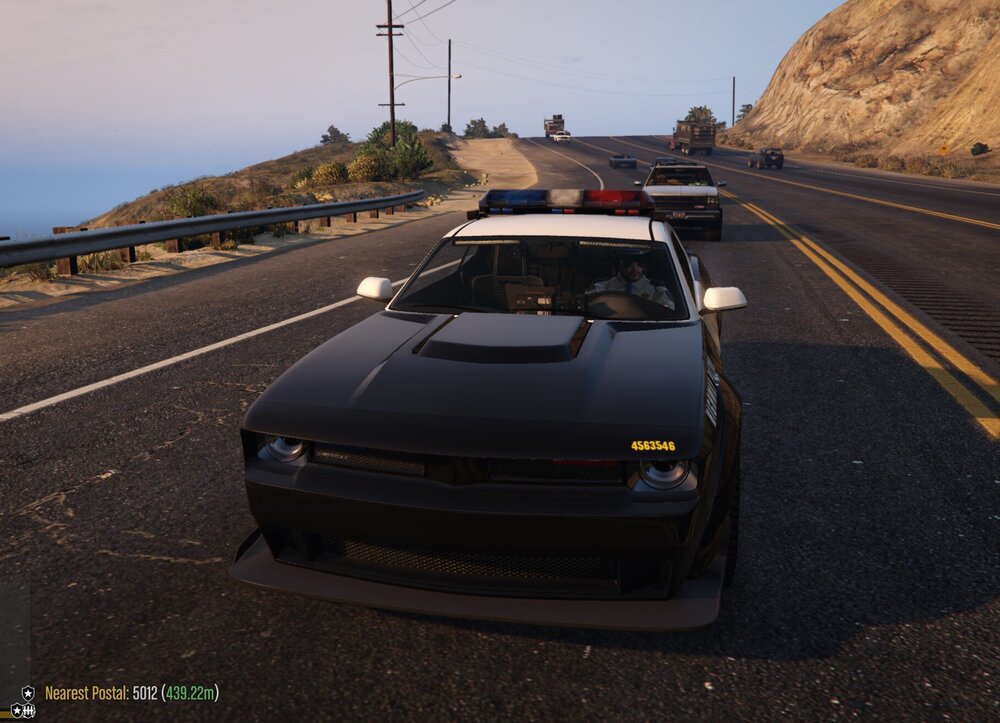 Could contain: outdoor, vehicle, land vehicle, sky, wheel, road, automotive design, tire, ground, auto part, hood, car, mountain