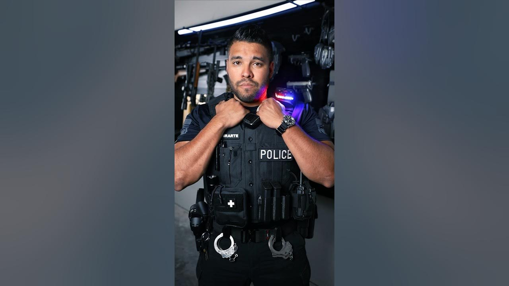 Could contain: person, human face, clothing, screenshot, wall