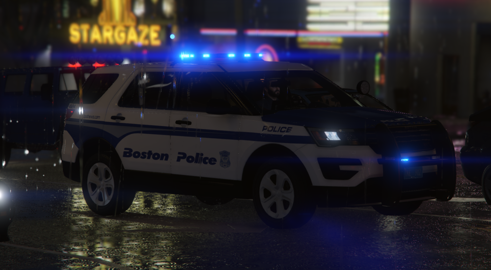 Could contain: vehicle, land vehicle, wheel, transport, tire, police car, car, text, sport utility vehicle, ford, law enforcement, emergency vehicle, auto part, outdoor, automotive exterior, road, street, night, police, light