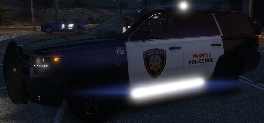 Could contain: vehicle, land vehicle, tire, wheel, car, text, outdoor, auto part, automotive exterior, road, bumper, law enforcement, police, ground