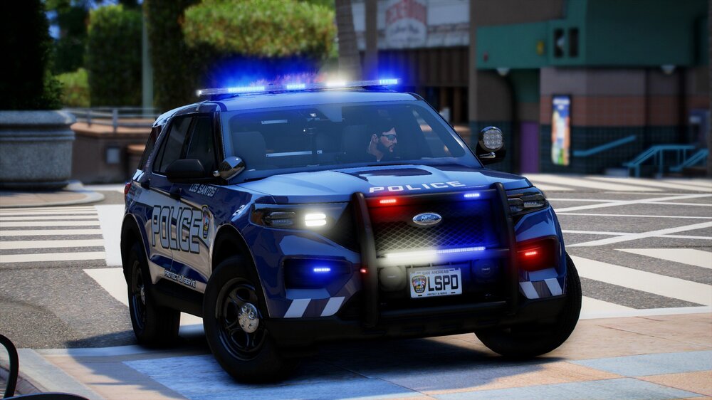 Could contain: land vehicle, vehicle, wheel, tire, outdoor, text, road, auto part, police car, law enforcement, vehicle registration plate, full-size car, automotive light bulb, ford, automotive exterior, transport, bumper, automotive lighting, car, police, street, blue, rally