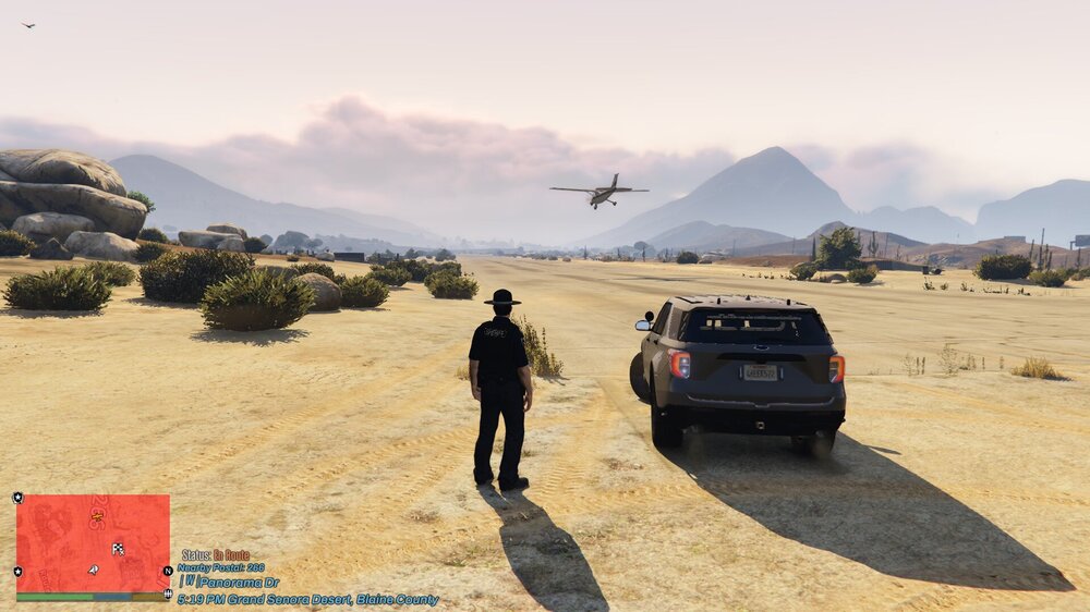 Could contain: outdoor, vehicle, sky, land vehicle, car, wheel, transport, mountain, ground, tire, text, helicopter, person, desert