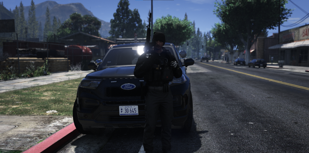 Could contain: outdoor, sky, vehicle, land vehicle, wheel, road, tree, tire, car, auto part, street, ground, person, police