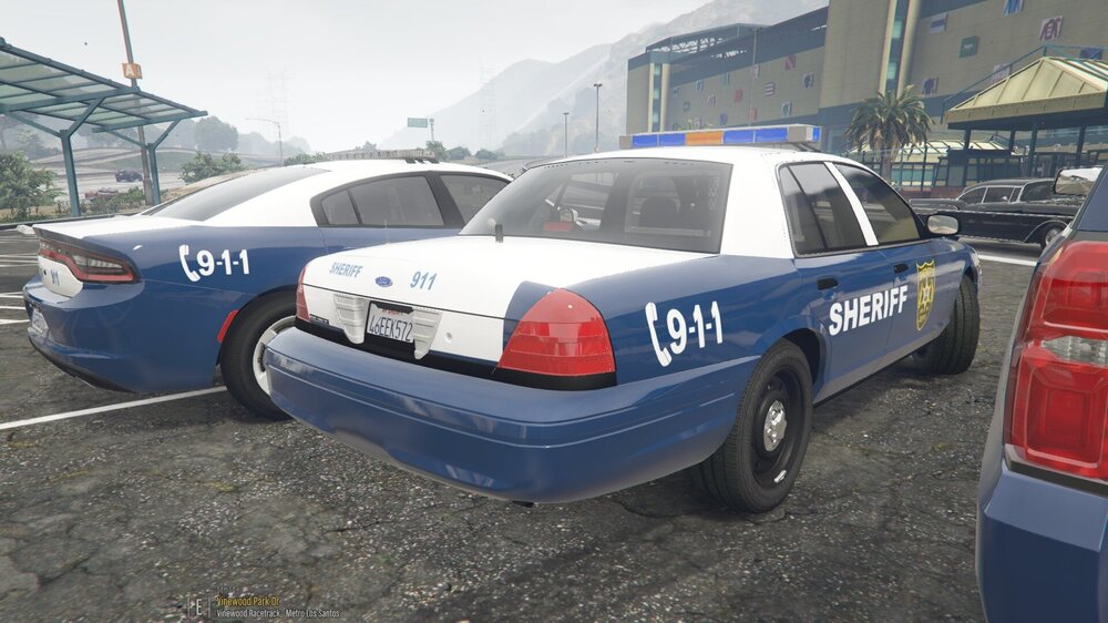 Could contain: vehicle, text, land vehicle, outdoor, wheel, vehicle registration plate, transport, tire, sedan, full-size car, automotive exterior, auto part, ford crown victoria police interceptor, police car, police, car, ground, parked