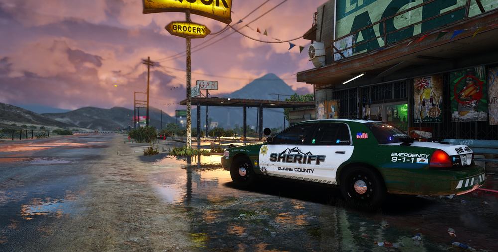 Could contain: outdoor, text, sky, vehicle, land vehicle, wheel, cloud, tire, building, street, car, road, taxi, transport, city, ground, mountain