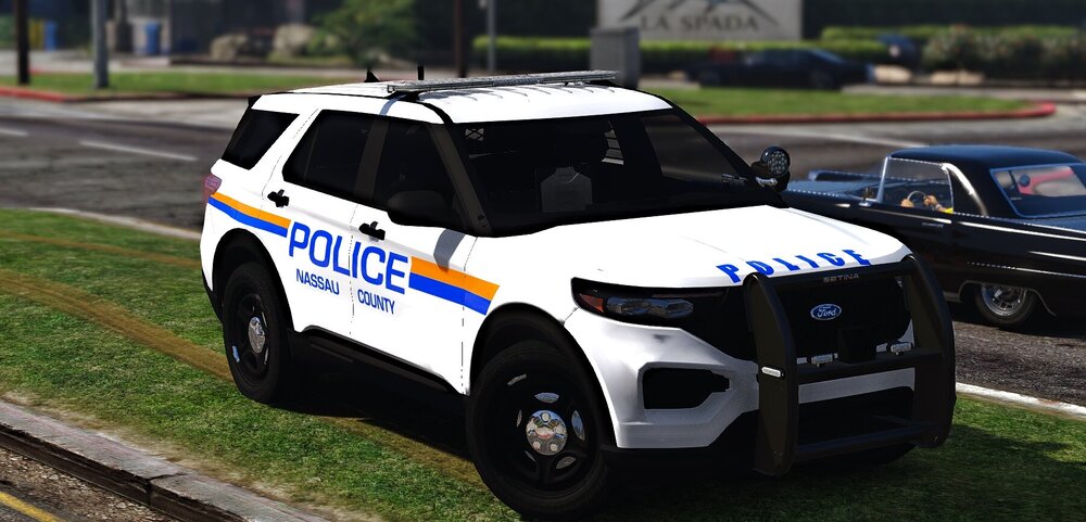 Could contain: vehicle, land vehicle, wheel, text, tire, outdoor, police car, law enforcement, car, bumper, auto part, automotive exterior, ford, grass, transport, road, police