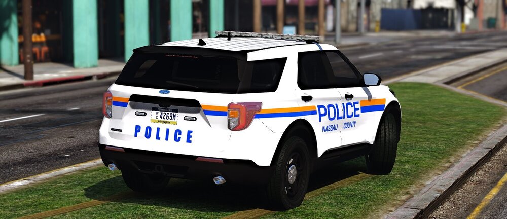 Could contain: text, land vehicle, vehicle, wheel, outdoor, police car, law enforcement, emergency service, emergency vehicle, vehicle registration plate, transport, tire, police van, automotive exterior, auto part, mode of transport, ford, road, emergency, motor vehicle, van, police, car, grass, street