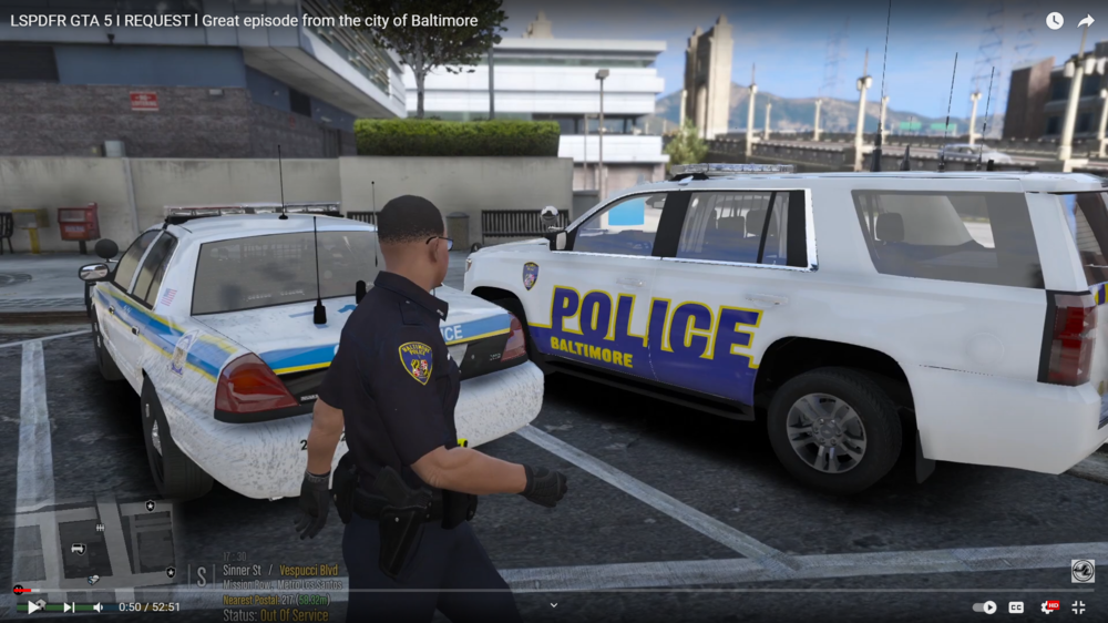 Could contain: vehicle, text, land vehicle, wheel, transport, tire, law enforcement, person, outdoor, clothing, automotive exterior, police car, auto part, police, officer, car, van, parked