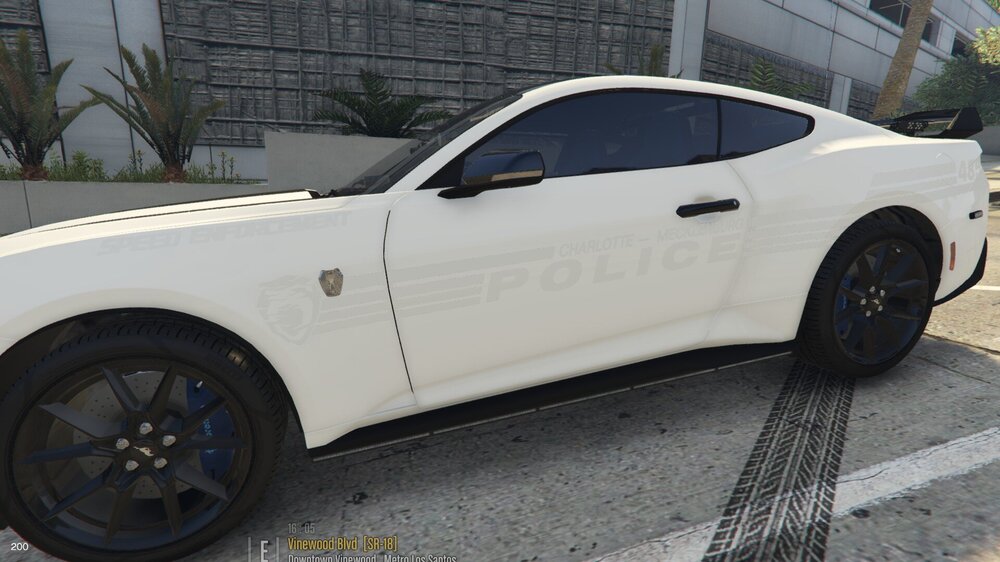 Could contain: wheel, vehicle, land vehicle, tire, transport, outdoor, auto part, alloy wheel, rim, automotive design, hood, car, luxury vehicle, sports car, ground, parked