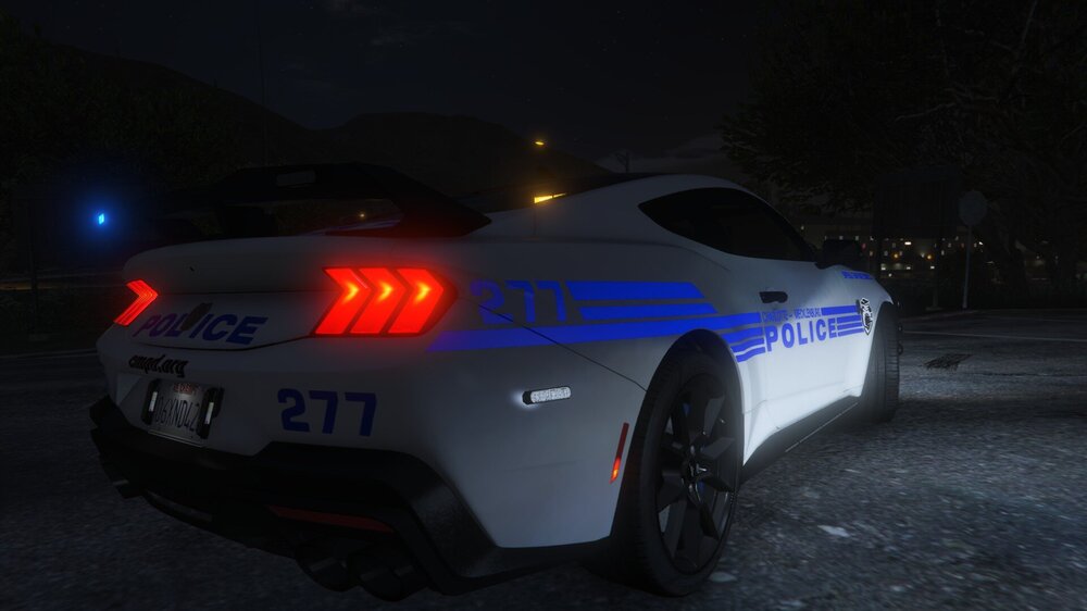 Could contain: vehicle, land vehicle, text, transport, wheel, outdoor, automotive lighting, auto part, vehicle registration plate, automotive design, tire, full-size car, sports sedan, automotive light bulb, mid-size car, automotive tail & brake light, bumper, car, automotive exterior, performance car, sports car, night, road, ground, light, police, street