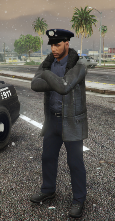 Could contain: clothing, person, outdoor, tire, ground, vehicle, land vehicle, wheel, trousers, car, man, footwear, road, wet suit