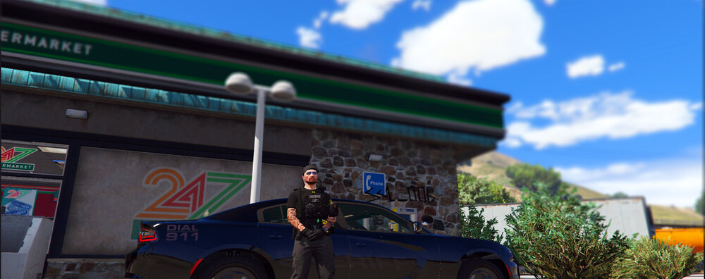 Could contain: sky, outdoor, wheel, vehicle, land vehicle, tire, building, cloud, billboard, auto part, blue, street, car, parked, shop, sign