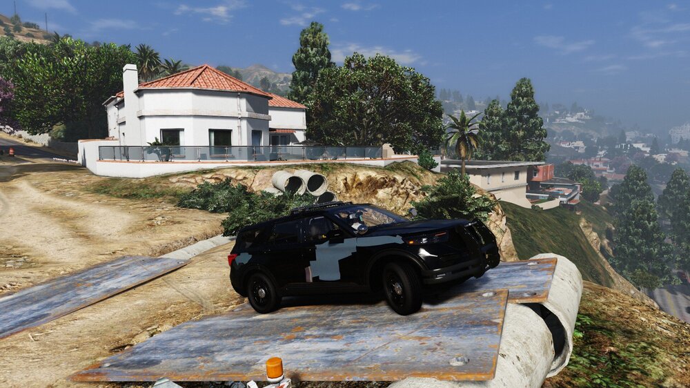 Could contain: outdoor, sky, wheel, tire, land vehicle, vehicle, ground, tree, grass, mountain