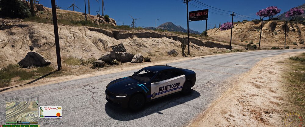 Could contain: outdoor, vehicle, land vehicle, ground, wheel, sky, text, car, road, transport, mountain, street, automotive, rally