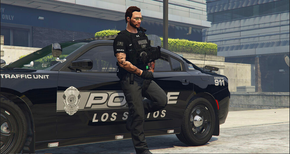 Could contain: vehicle, land vehicle, wheel, clothing, tire, text, outdoor, law enforcement, building, person, police, transport, auto part, road, man, police car, officer, footwear, car, street