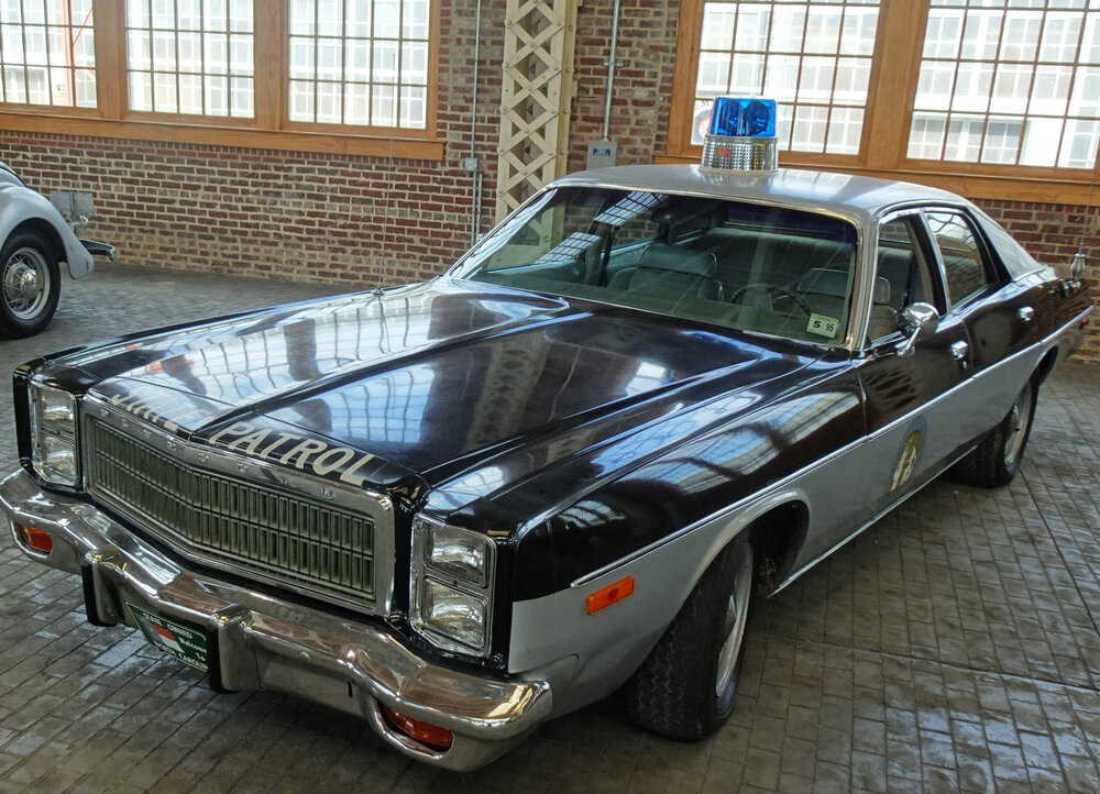 Could contain: vehicle, land vehicle, wheel, ground, tire, transport, parked, hardtop, bumper, classic car, grille, auto part, floor, window, car, indoor