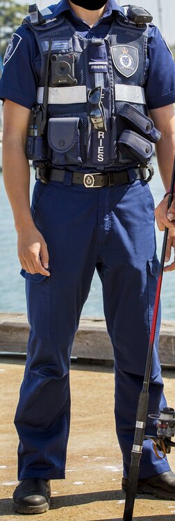 Could contain: clothing, person, outdoor, man, police officer, police, footwear, trousers, personal protective equipment, law enforcement, security, uniform, ground