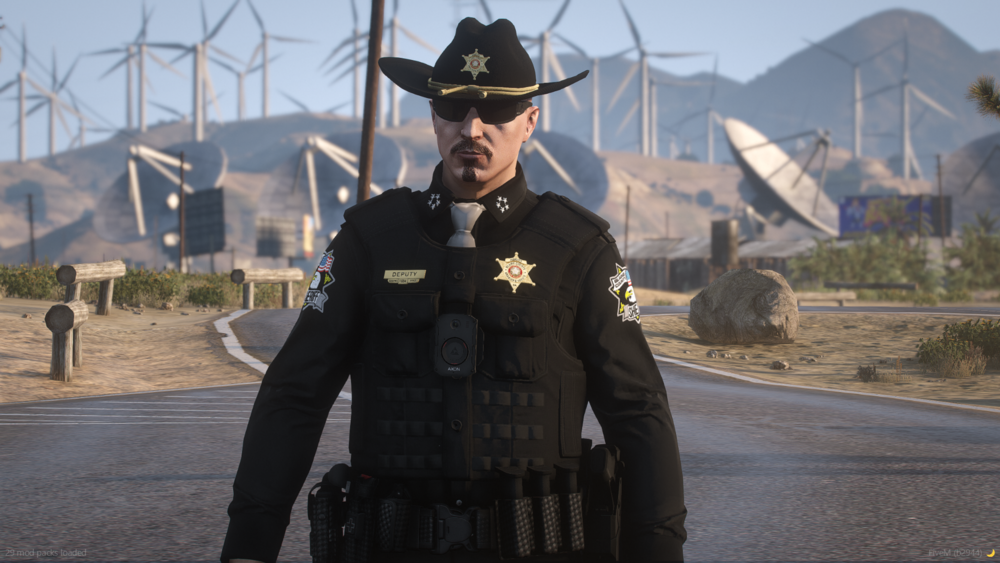 Could contain: clothing, outdoor, person, sky, windmill, hat, man, mountain