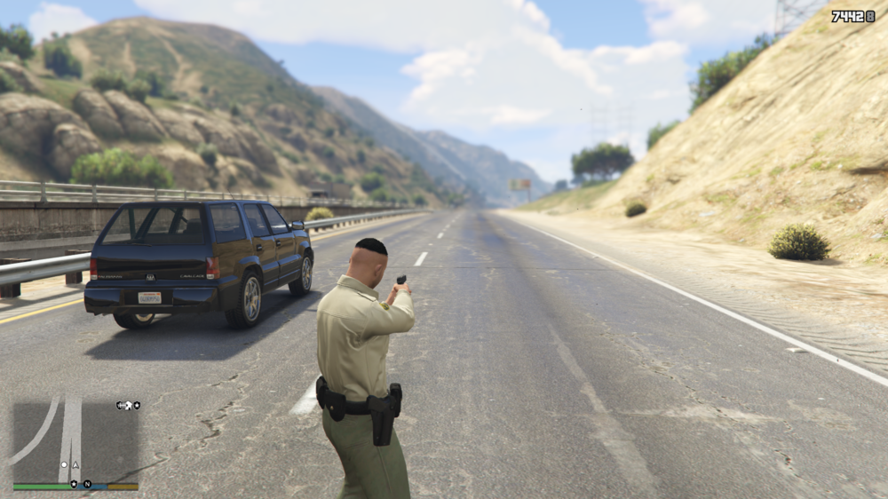 Could contain: outdoor, vehicle, land vehicle, road, sky, wheel, person, cloud, tire, clothing, mountain, man, truck, van, car, street, highway, ground