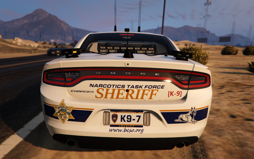 Could contain: vehicle, text, land vehicle, outdoor, sky, automotive design, wheel, bumper, automotive exterior, tire, vehicle registration plate, mountain, ground, car