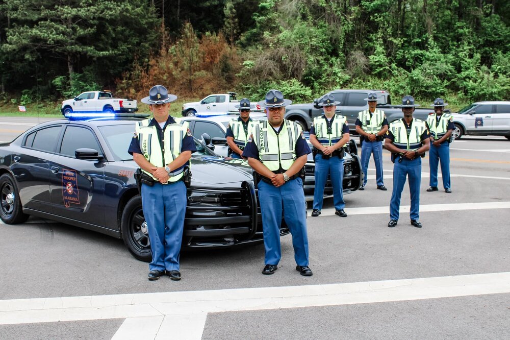 Could contain: vehicle, land vehicle, outdoor, clothing, person, tree, wheel, law enforcement, road, car, man, full-size car, police, officer, people, street