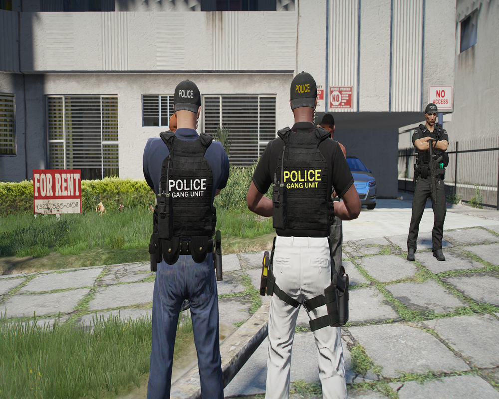 Could contain: clothing, outdoor, person, building, grass, trousers, footwear, man, plant