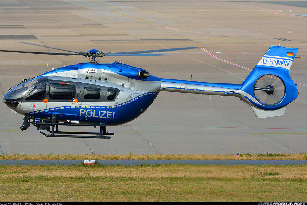 Could contain: aircraft, transport, vehicle, helicopter, outdoor, grass, plane, helicopter rotor, air travel, aviation, rotorcraft, airport, ground, blue, runway