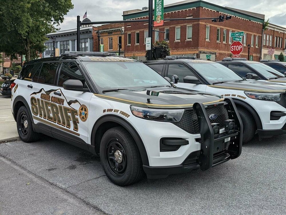 Could contain: land vehicle, vehicle, outdoor, wheel, tire, transport, bumper, police, automotive exterior, auto part, car, road, street, parked