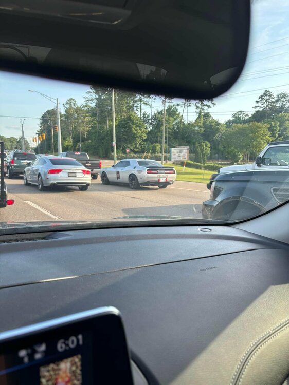 Could contain: car, outdoor, land vehicle, car mirror, windshield, rear-view mirror, automotive mirror, road, automotive side-view mirror, sky, mirror, auto part, motor vehicle, automotive exterior, street, vehicle