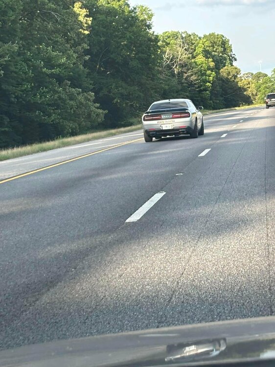 Could contain: outdoor, road, vehicle, land vehicle, tree, car, lane, asphalt, highway, freeway, wheel, road surface, thoroughfare, street, windshield, tarmac, sky, tar, motor vehicle, family car, automotive exterior, shoulder, vehicle registration plate, infrastructure, rear-view mirror, way, driving