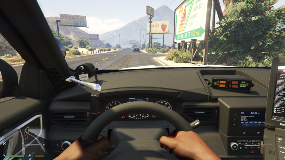 Could contain: text, vehicle, land vehicle, outdoor, car, windshield, person, mirror, auto part, wheel, driving, motor vehicle, automotive mirror, control panel, road