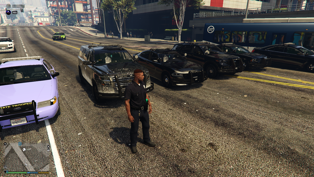 Could contain: land vehicle, vehicle, outdoor, wheel, road, text, traffic, tire, ground, mode of transport, car, bus, street, police