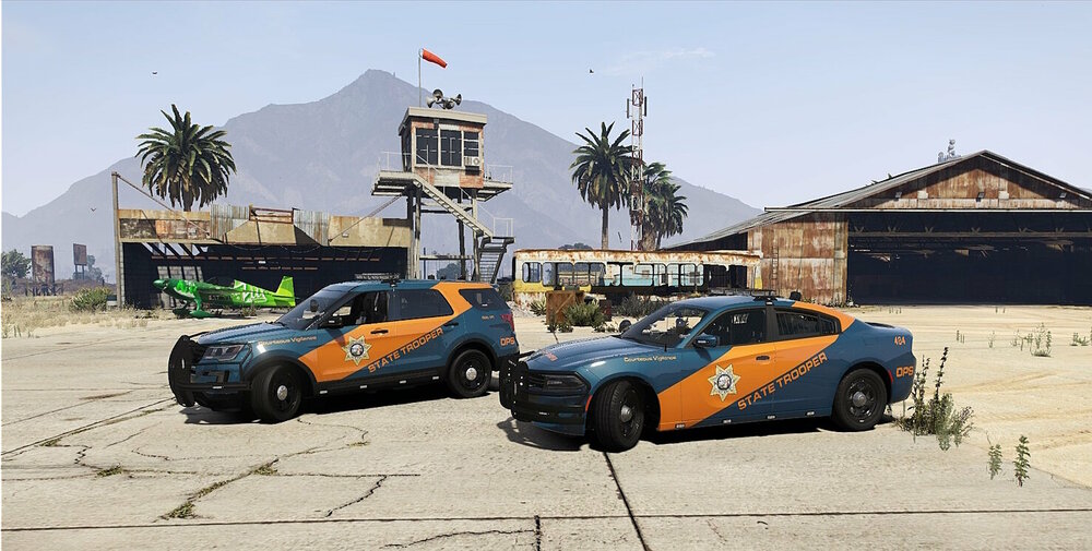 Could contain: sky, outdoor, land vehicle, wheel, vehicle, tire, building, ground, parked, car, mountain