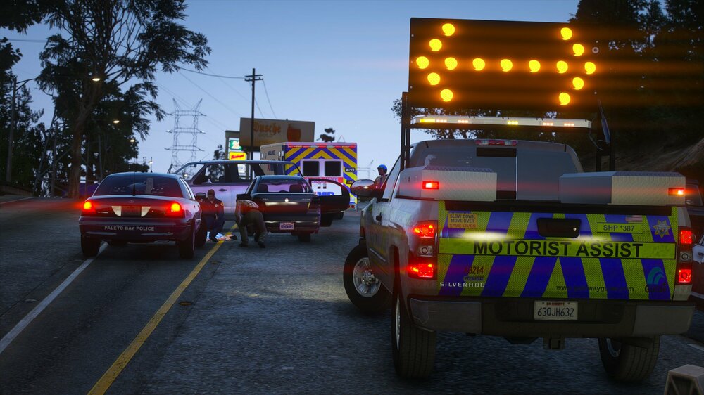 Could contain: land vehicle, vehicle, outdoor, wheel, road, sky, transport, text, vehicle registration plate, car, street, truck, emergency service, tire, light, auto part, emergency vehicle, traffic, automotive exterior, automotive tail & brake light, emergency, mode of transport, motor vehicle, tree, automotive lighting, police, driving