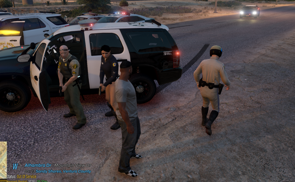 Could contain: vehicle, land vehicle, outdoor, car, wheel, man, tire, clothing, text, ground, law enforcement, person, police