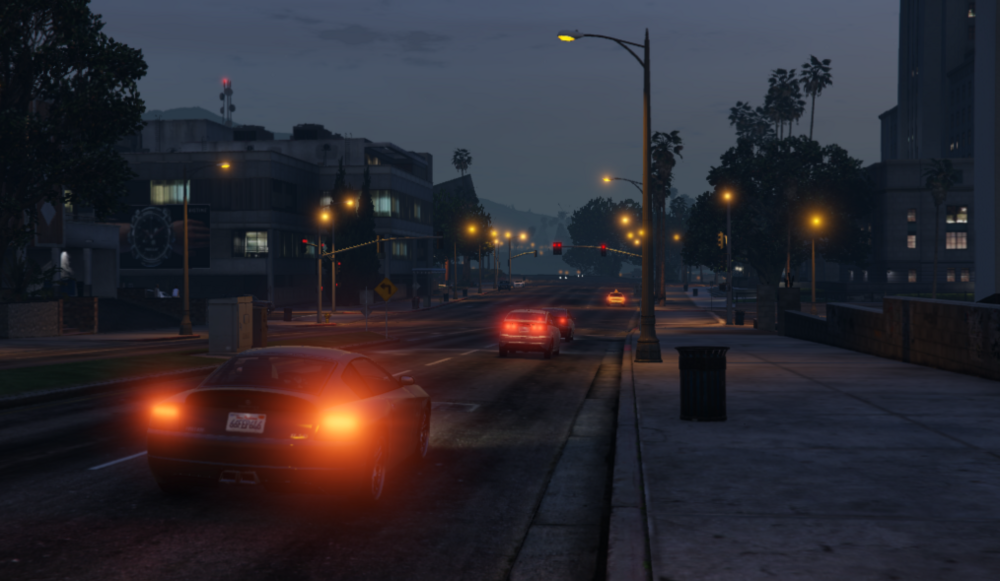 Could contain: outdoor, street light, sky, road, light, street, vehicle, land vehicle, tree, night, electricity, road surface, security lighting, thoroughfare, building, way, infrastructure, car, traffic, city