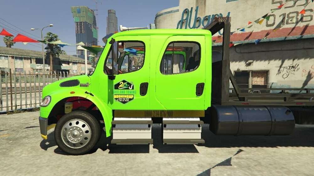 Could contain: vehicle, wheel, transport, land vehicle, outdoor, sky, tire, auto part, motor vehicle, truck, green, mode of transport, building, light commercial vehicle, commercial vehicle, parked, ground