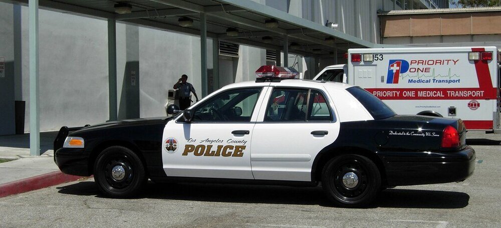 Could contain: vehicle, land vehicle, wheel, tire, text, law enforcement, car, transport, police car, ford crown victoria police interceptor, auto part, emergency service, building, vehicle registration plate, emergency vehicle, automotive exterior, motor vehicle, bumper, outdoor, full-size car, automotive tail & brake light, road, police, emergency