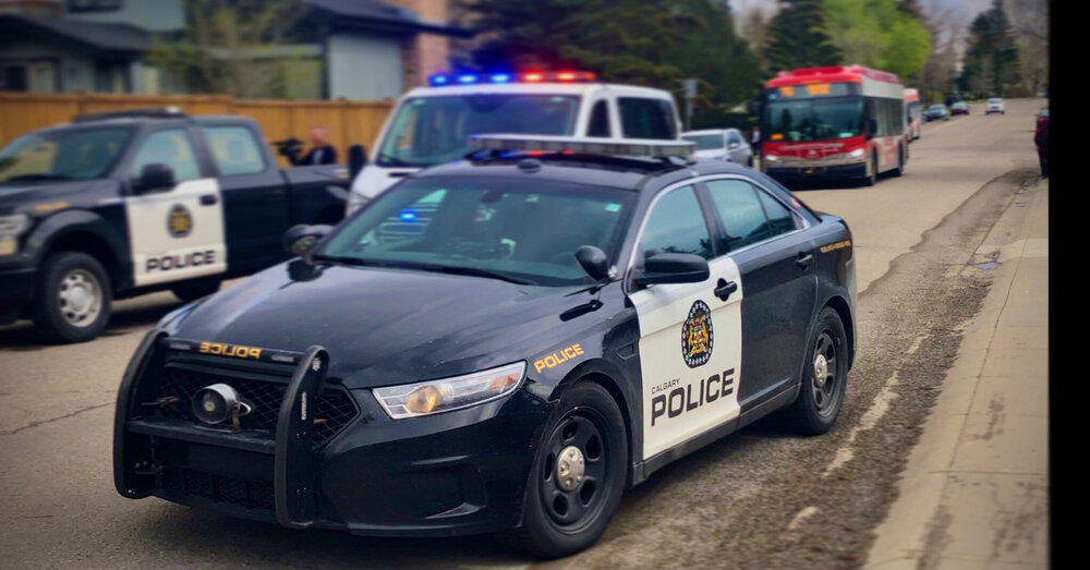 Could contain: land vehicle, vehicle, wheel, outdoor, text, tire, mid-size car, police car, full-size car, vehicle registration plate, law enforcement, auto part, transport, sports sedan, automotive design, automotive exterior, bumper, road, street, car, police