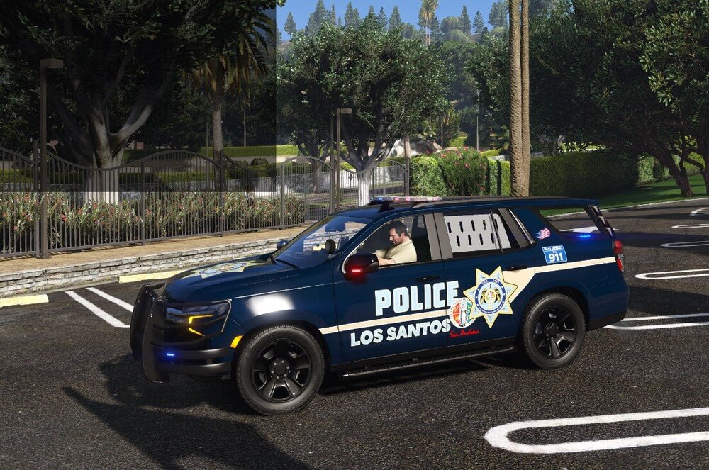Could contain: vehicle, land vehicle, wheel, outdoor, tire, road, car, tree, motorsport, transport, auto part, text, police car, police, street, rally