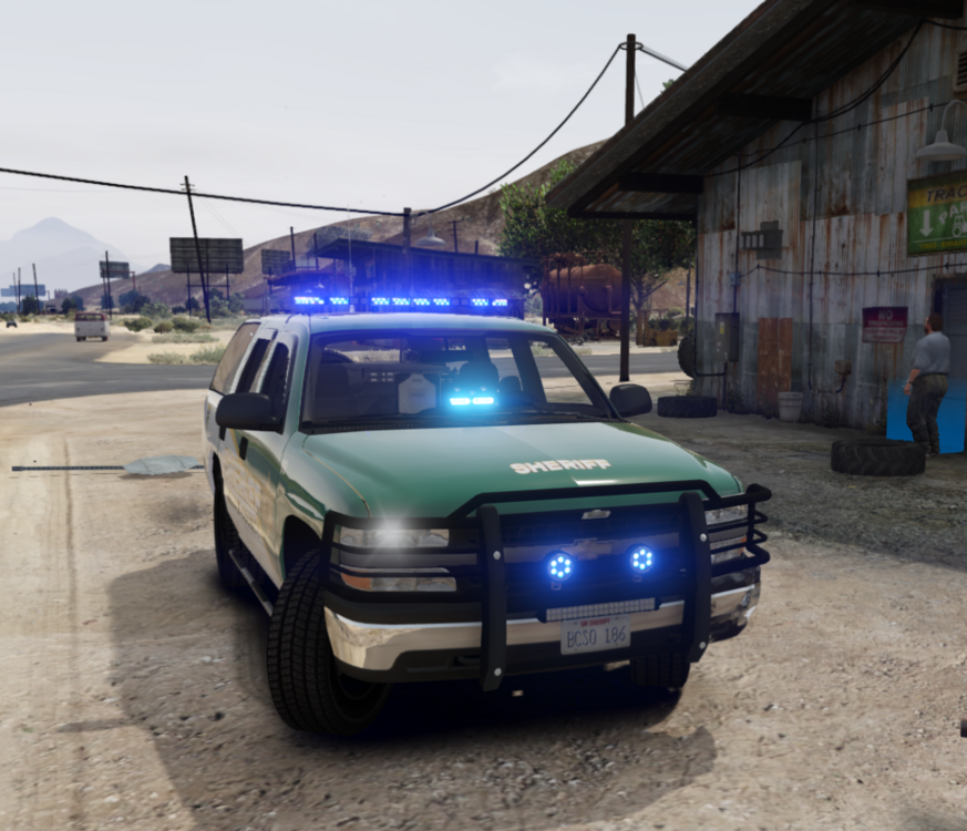 Could contain: vehicle, land vehicle, outdoor, wheel, transport, sky, tire, ground, police, vehicle registration plate, bumper, auto part, ford, automotive exterior, car, road, motor vehicle, law enforcement, automotive lighting, full-size car, roof rack, street