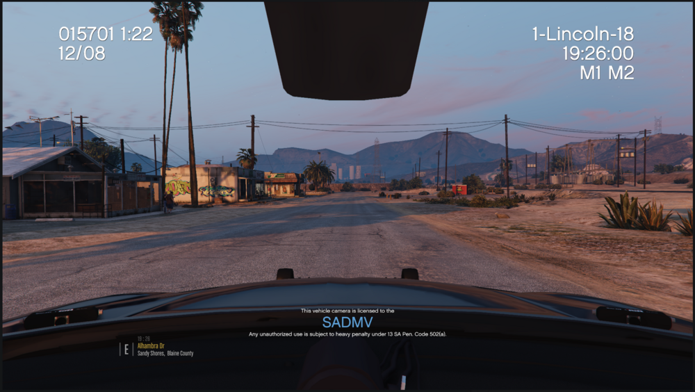Could contain: text, outdoor, sky, vehicle, car, land vehicle, road, screenshot, mirror, windshield, street, mountain, driving