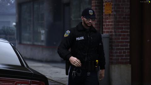 Could contain: clothing, person, vehicle, building, land vehicle, law enforcement, man, car, police officer, outdoor, officer, police, street