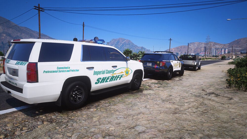 Could contain: vehicle, outdoor, land vehicle, wheel, sky, tire, text, transport, vehicle registration plate, auto part, sport utility vehicle, motor vehicle, automotive exterior, automotive luggage rack, roof rack, police car, compact sport utility vehicle, automotive carrying rack, police, parked, ground, mountain, car, van