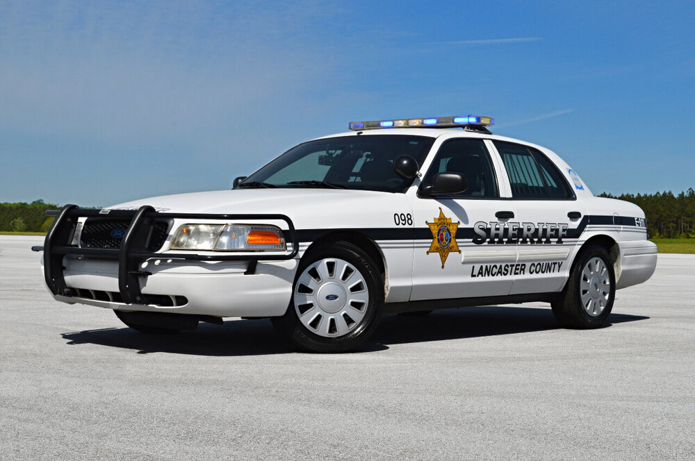 Could contain: vehicle, land vehicle, wheel, transport, outdoor, sky, police car, law enforcement, car, police, full-size car, tire, emergency vehicle, ford, emergency service, bumper, ford crown victoria police interceptor, auto part, roof rack