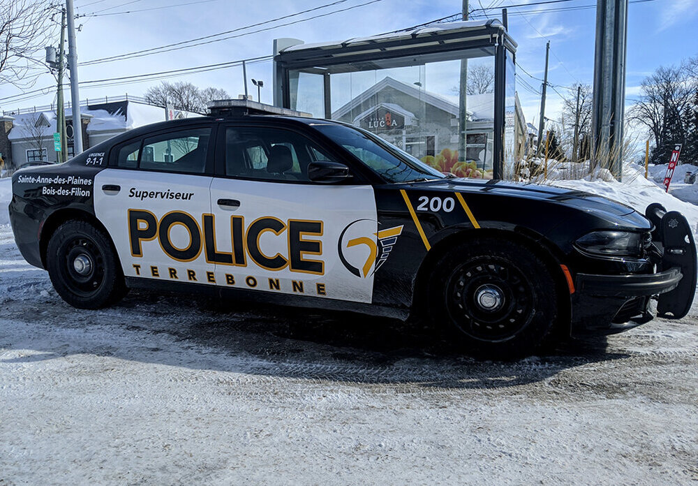 Could contain: vehicle, land vehicle, outdoor, wheel, transport, sky, tire, text, auto part, police car, law enforcement, full-size car, bumper, automotive exterior, car, police, ground, street, parked