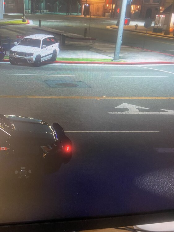 Could contain: vehicle, land vehicle, car, outdoor, road, wheel, automotive lighting, automotive tail & brake light, auto part, windshield, street, light, night, ground